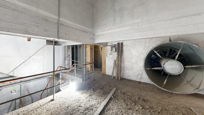 Interior of a warehouse with building services and ventilation